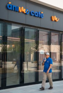 man walking beside coffee shop during Dubai launch strategy in Silicon Oasis