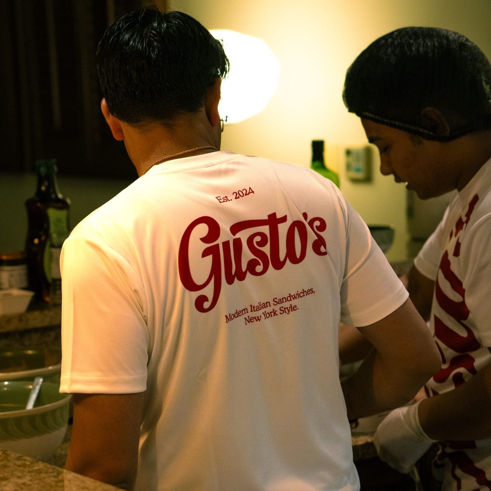 man working on a sandwich for a cloud kitchen marketing event