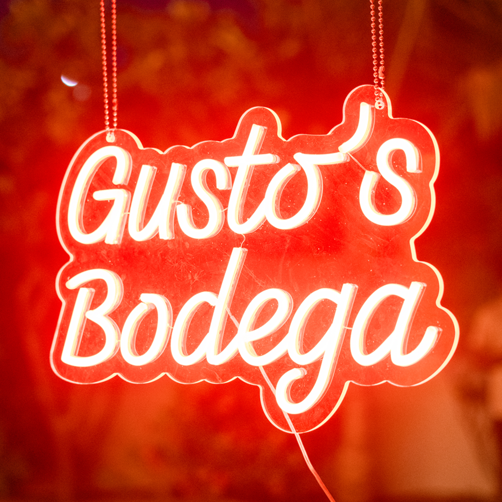 gustos bodega in neon sign