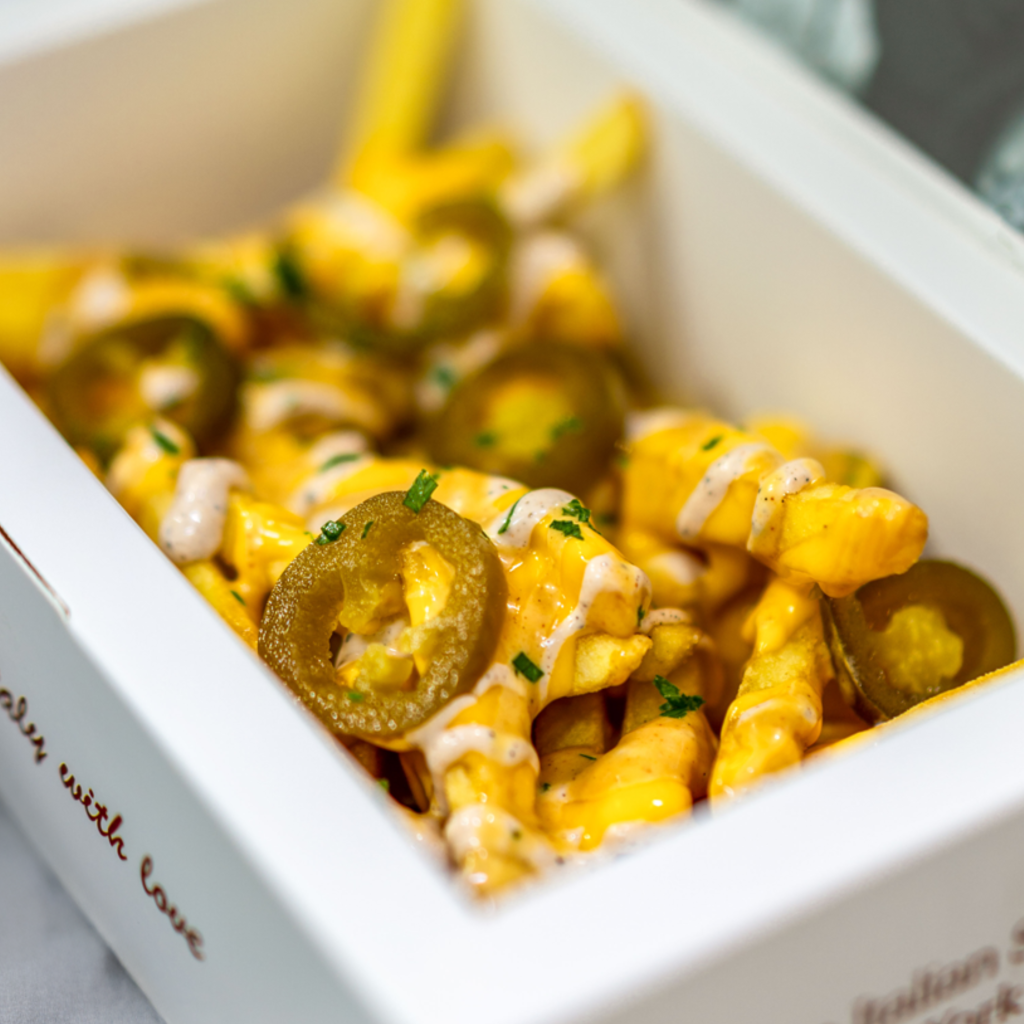 fries inside a box looking delicious and cheesy