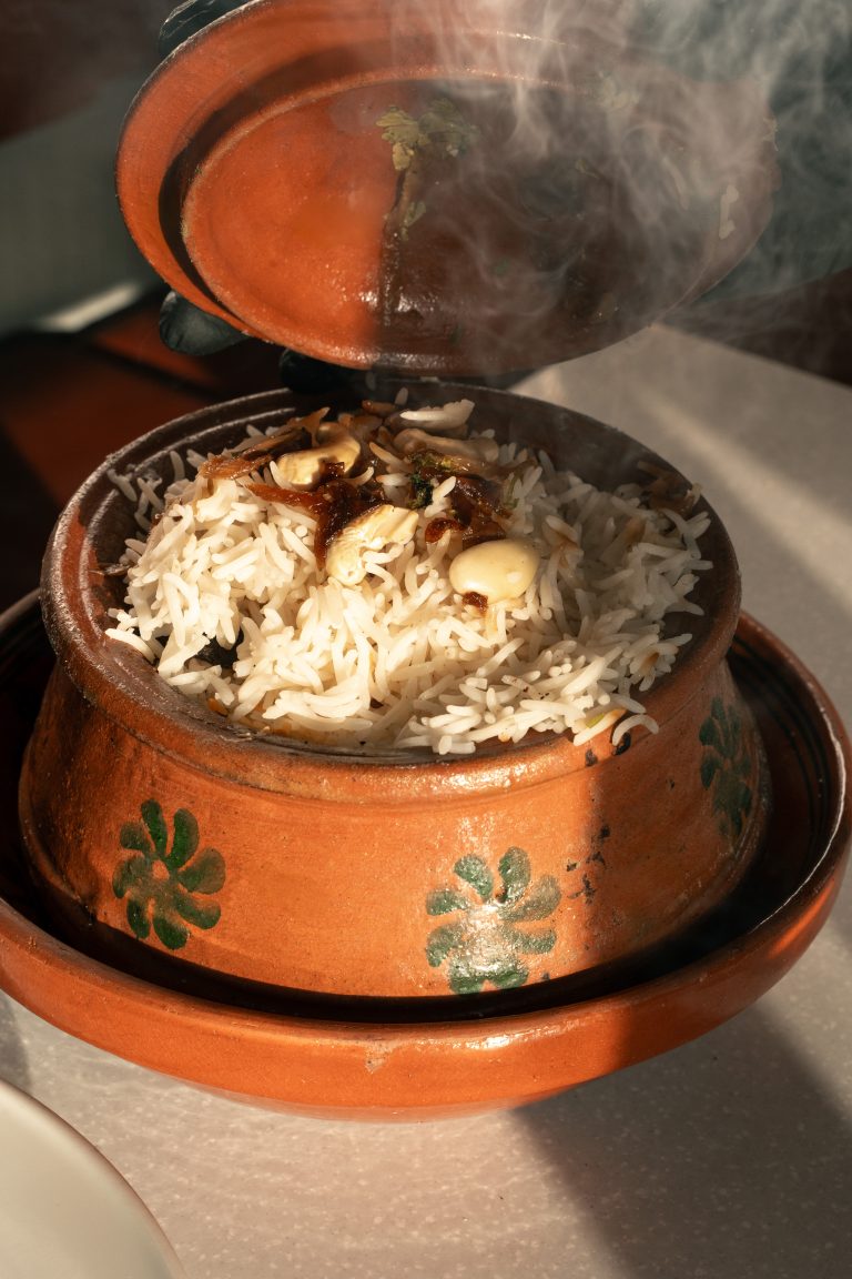 Organic restaurant content strategy: Nayaab Haandi's signature Handi dish with café-style photography and atmospheric textures