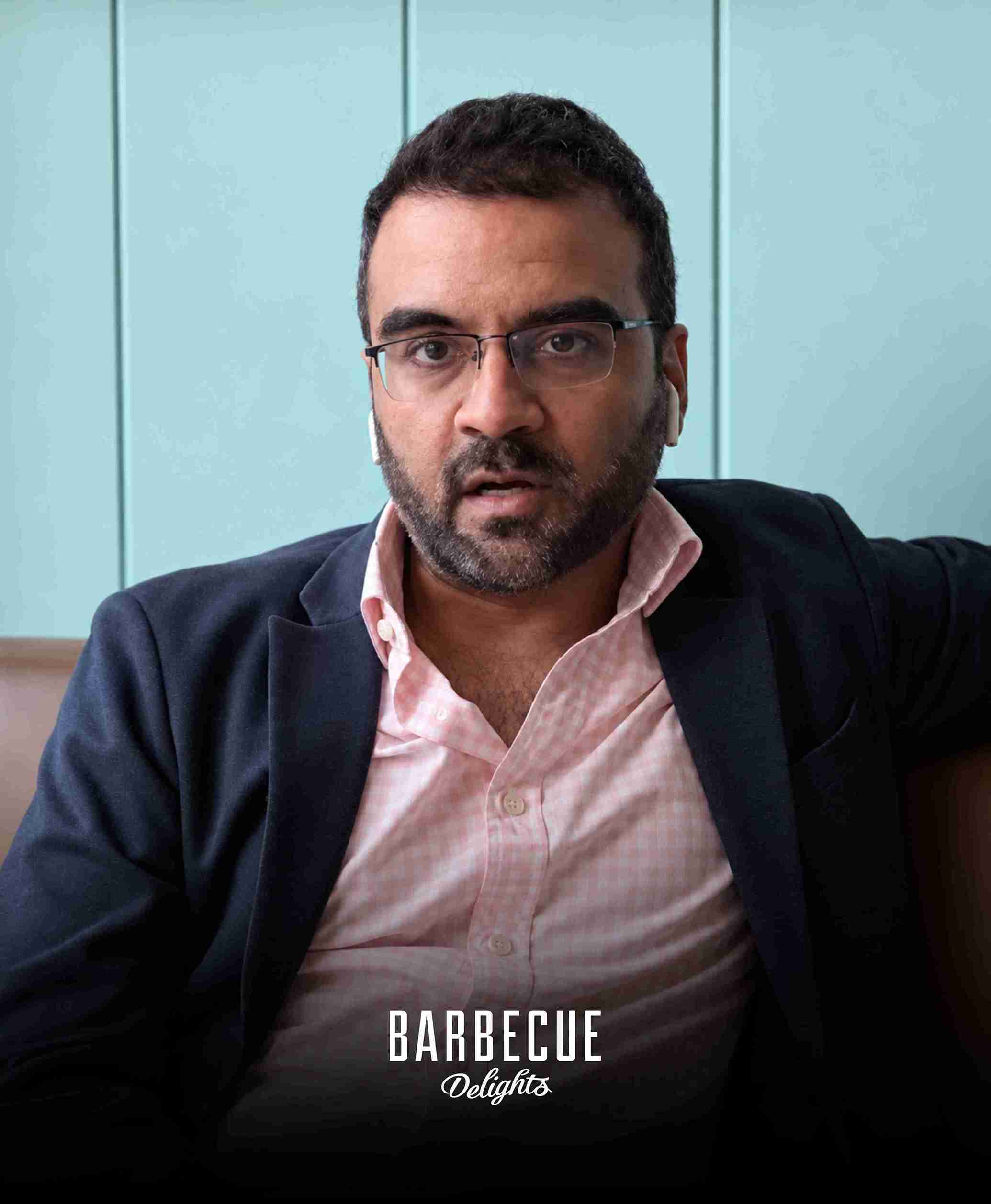Punit, Marketing Manager of Barbecue Delights reviewing Donut Media