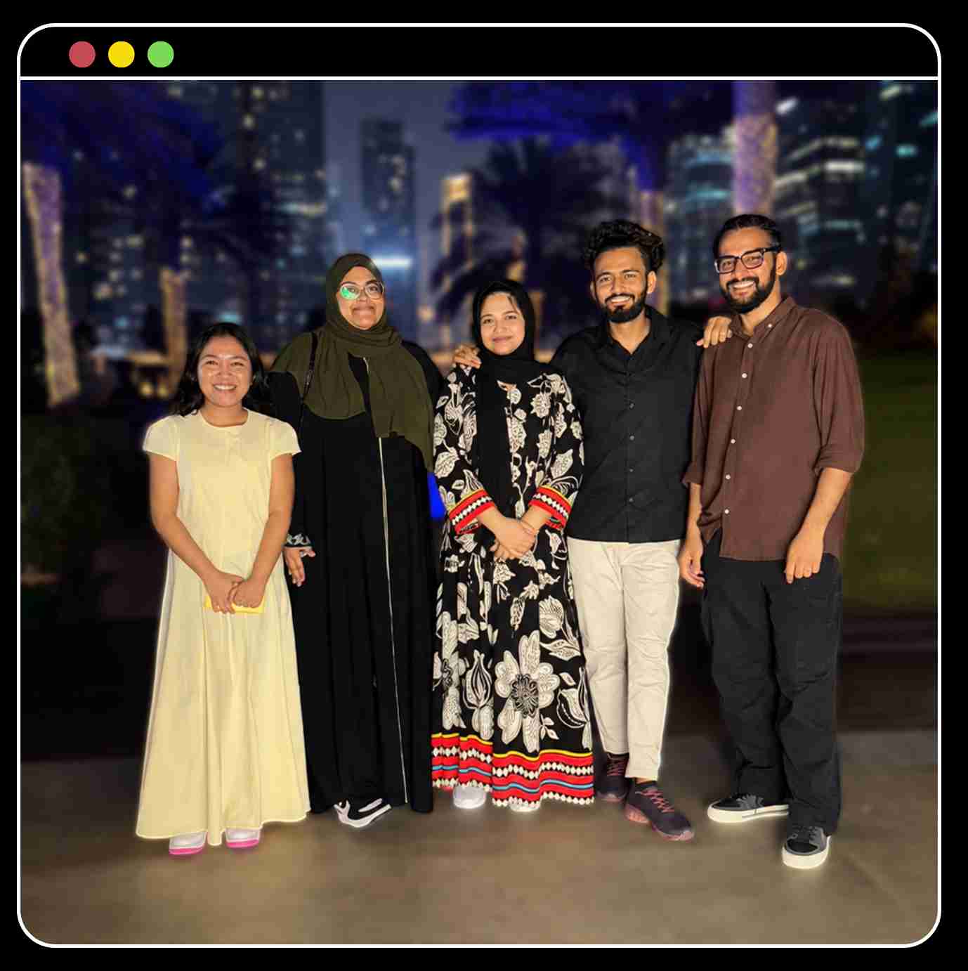 The Donut Media team standing together at night in Dubai