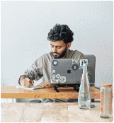 Founder Hamza planning restaurant social media strategy at his workspace