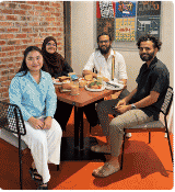 Donut Media team members sitting together at a restaurant table